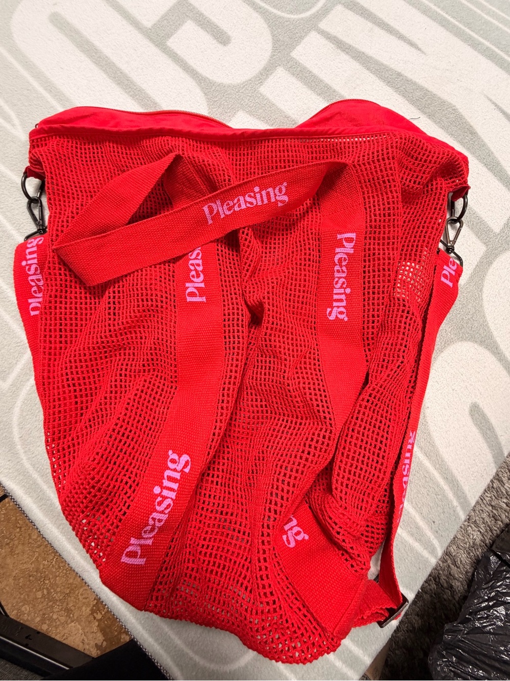 Pleasing Red Mesh Tote with Branded Straps